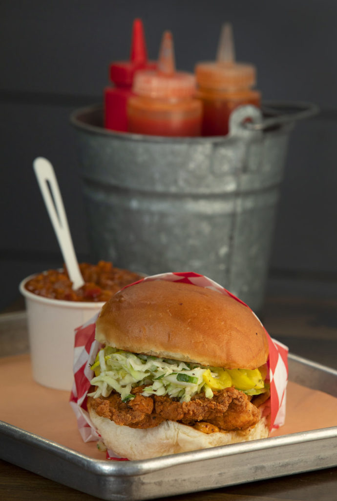 Golden Boy fried chicken sandwich with slaw, pickles and pimento cheese and a side of baked beans from Boxcar Fried Chicken & Biscuits in on Hwy 12 near Sonoma. (photo by John Burgess/The Press Democrat)