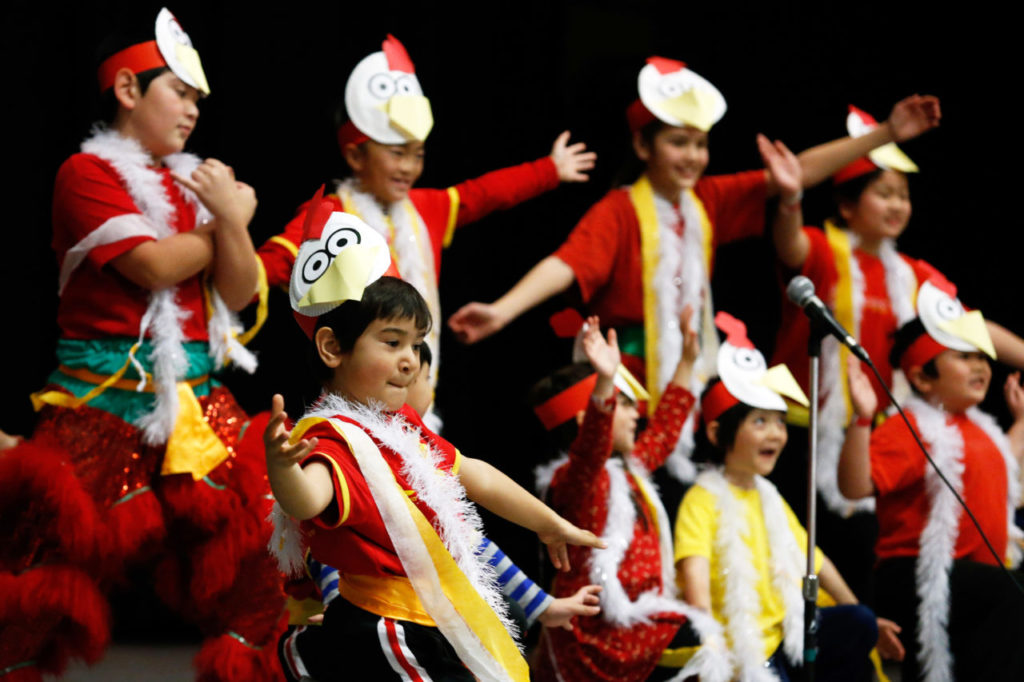 Max Armstrong, 6, and other young members of the Redwood Empire Chinese Association (RECA) help ring in the Year of the Rooster with song and dance during RECA's Chinese New Year celebration at Veterans Memorial Hall in Santa Rosa, California on Saturday, February 18, 2017. (Alvin Jornada / The Press Democrat)