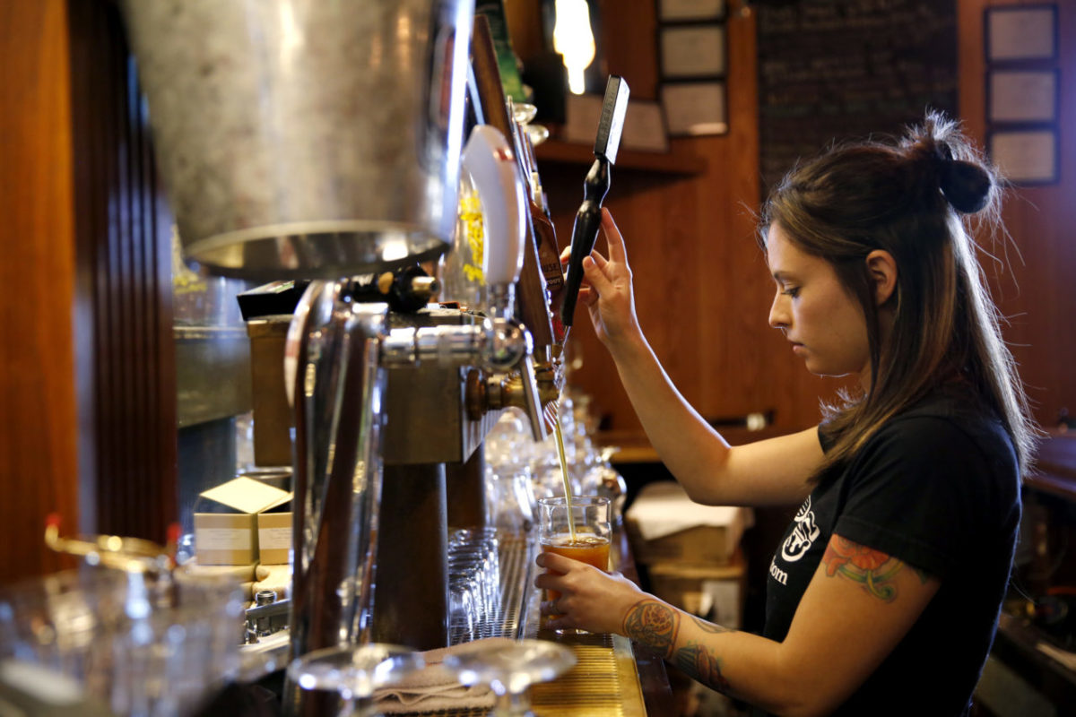 Bartender Cheryl Avery pours a pint of beer at Taps Restaurant and Tasting Room on Tuesday, September 3, 2013 in Petaluma, California. (BETH SCHLANKER/ The Press Democrat)