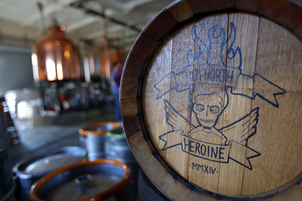 The 101 North Brewing Company Heroine logo is emblazoned on the side of a barrel at their Petaluma brewing facility. (Christopher Chung/ The Press Democrat)