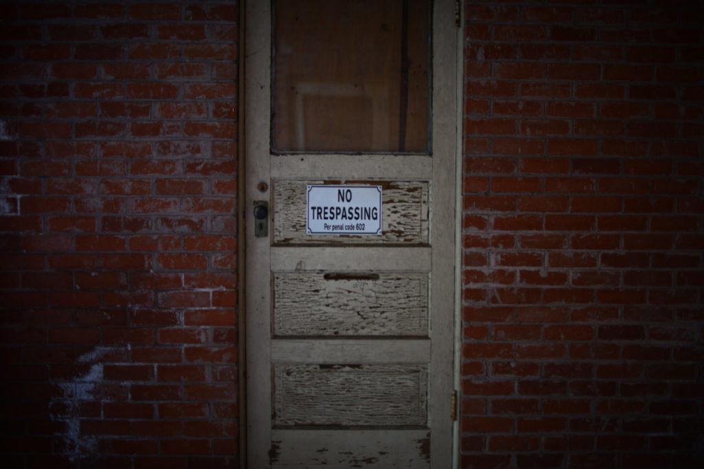 Many of the doors have no trespassing signs on The Main Building of the Sonoma Development Center in Eldridge, California. The building is currently not it use. June 29, 2015. (Photo: Erik Castro/for Sonoma Magazine)
