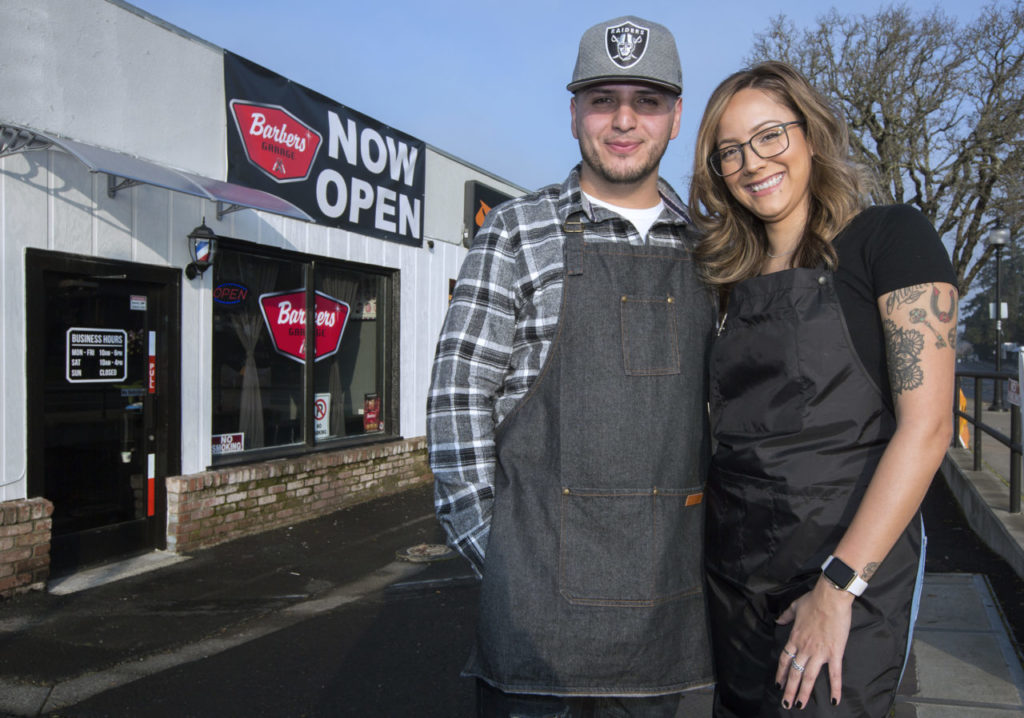 Jose Alvarez, proprietor of Barbers Garage, with shop manager and fellow barber Cristina Sanchez. (Photo by Robbi Pengelly/Index-Tribune)