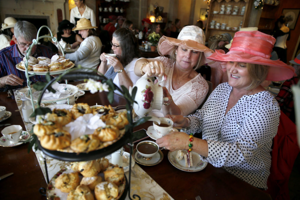 Kimberly Coenen pours tea for Andrea Christensen, right, during a Mary Poppins Holiday Tea Party at The Tudor Rose English Tea Room in Santa Rosa. (Beth Schlanker/The Press Democrat)