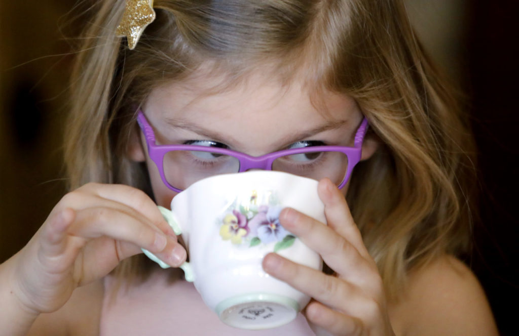 Stella Negri, 4, drinks from her teacup during a Mary Poppins Holiday Tea Party at The Tudor Rose English Tea Room in Santa Rosa, on Sunday, December 17, 2017. (BETH SCHLANKER/ The Press Democrat)