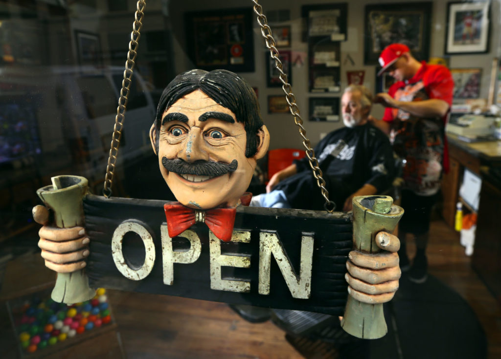 Steve DuBois cuts hair in his one seat Plaza Barber shop in Healdsburg. (JOHN BURGESS / The Press Democrat)