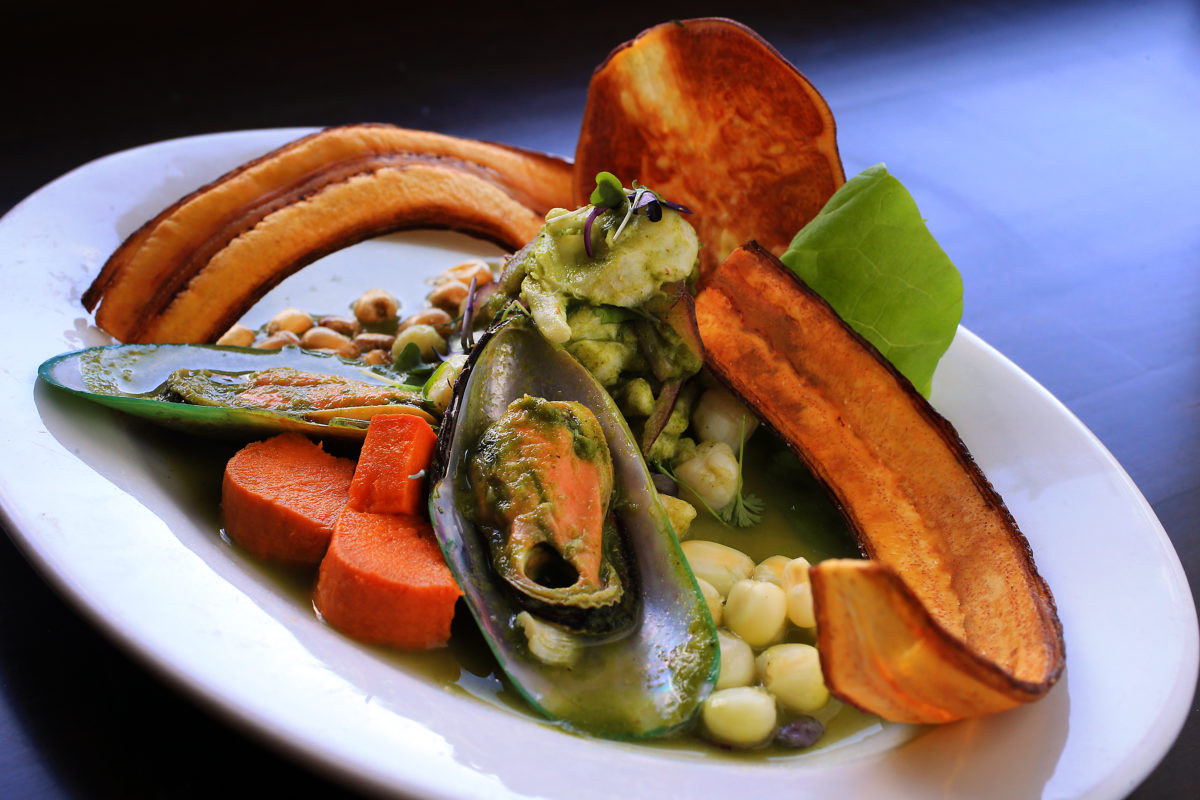 Ceviche Verde with tilapia, scallops, green lip mussels in a cilantro, parsley, Huacatay (black mint sauce), Asian celery, ginger, garlic and lime juice sauce topped with ricoto pepper and served with toasted cancha, Cuzco corn, sweet potato and plantain chips from chef/owner Jose Navarro of Sazon Peruvian Cuisine in Santa Rosa. (John Burgess/The Press Democrat)