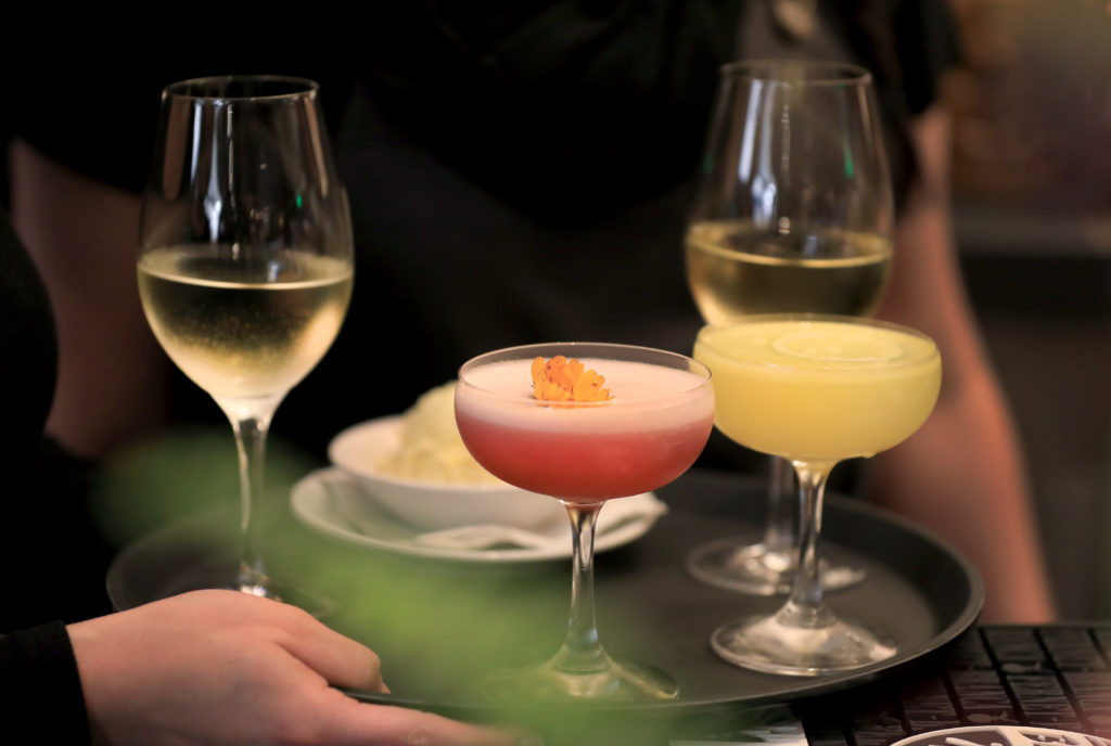 Drinks, including wine and a Guilty Pleasure, middle, are carried to customers at Sweet T's in Windsor, Monday, March 4, 2019. Sweet T's was destroyed during the Tubb's fire as it roared over Fountaingrove and in to Santa Rosa. (Kent Porter / The Press Democrat) 2018