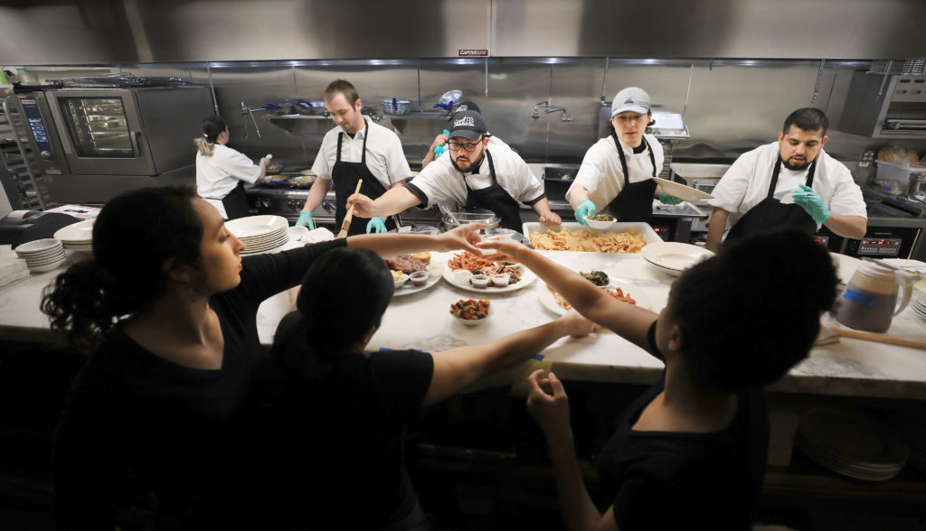 During a soft opening for Sweet T's in Windsor, Monday, March 4, 2019 the chefs and servers prepare meals for their customers. Sweet T's was destroyed during the Tubb's fire as it roared over Fountaingrove and in to Santa Rosa. (Kent Porter / The Press Democrat) 2018