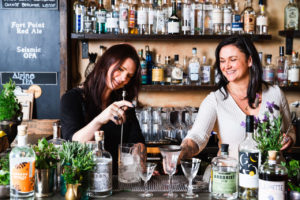 Co-founders Tara Heffernon and Laura Sanfilippo mixing drinks at Duke's Spirited Cocktails. (Photo Credit: Nat and Cody Gantz)