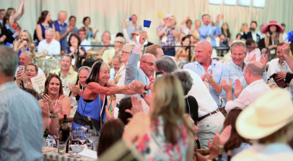 Bidders celebrate winning the Opus One offering at the Auction Napa Valley, Saturday June 2nd, 2018 at Meadowood Napa Valley in Saint Helena California. (Photo Will Bucquoy / For the Press Democrat).