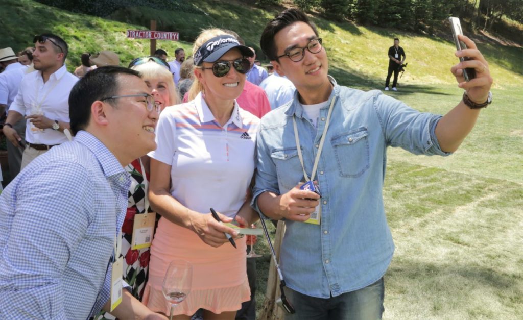 LPGA golfer, Natalie Gulbis poses for a selfie with Sungkuk Park (right) and Yeongjun Chang (right) at the Auction Napa Valley, Saturday June 2nd, 2018 at Meadowood Napa Valley in Saint Helena California. (Photo Will Bucquoy / For the Press Democrat).