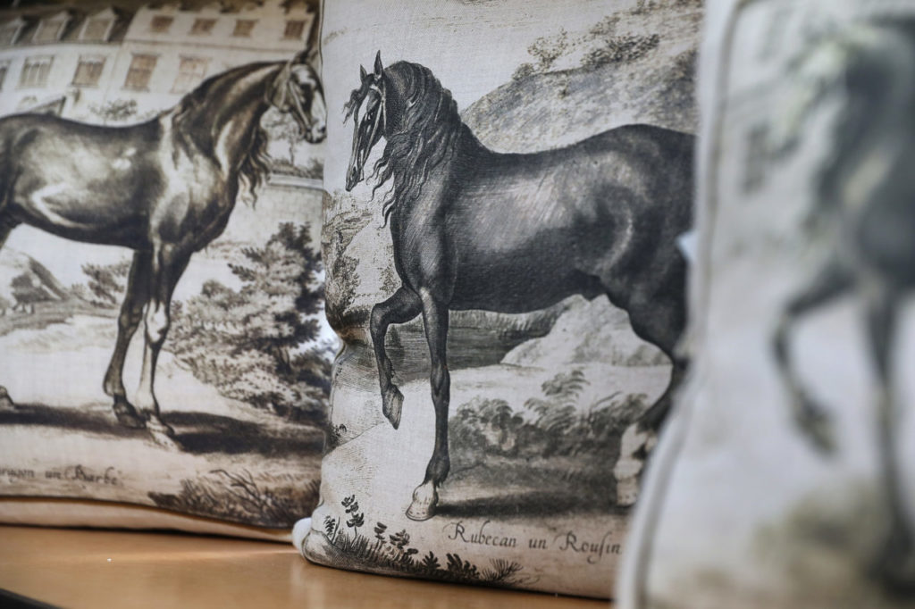 Pillows depicting horses are a popular item produced by Dallas A. Saunders. (Christopher Chung/ The Press Democrat)
