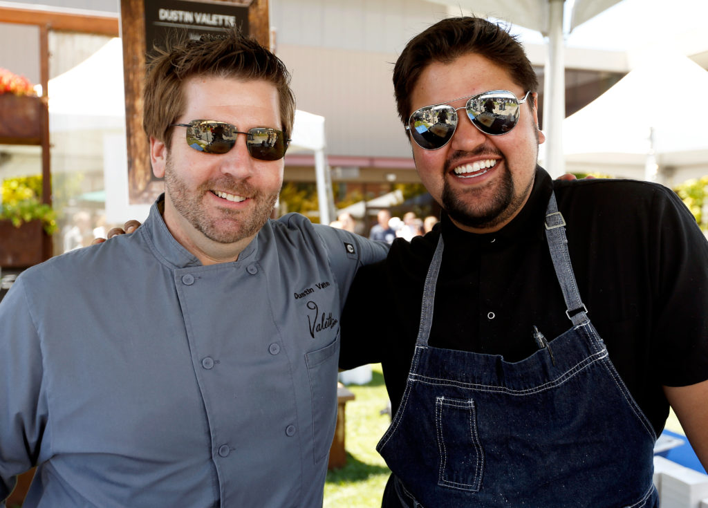 Chef Dustin Valette, left, and line cook Alec Graham of Valette restaurant during the North Coast Food and Wine Festival at SOMO Village in Rohnert Park, California, on Saturday, June 10, 2017. (Alvin Jornada / The Press Democrat)