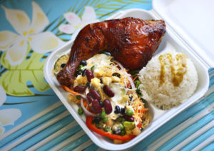 Barbecue chicken with a salad and curry rice from Red Bee BBQ in Santa Rosa. (Conner Jay/The Press Democrat)
