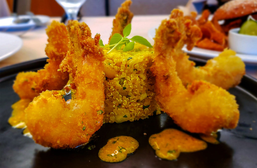 Panko-crusted shrimp with curried quinoa, mango, avocado and curry dressing at the SRJC Culinary Cafe in Santa Rosa. Heather Irwin/PD