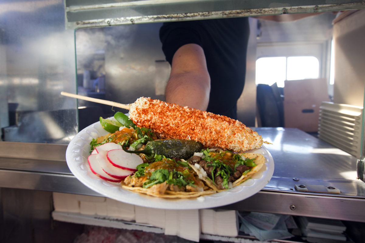 Carnitas, asada and chicken street tacos with an elote with mayo, cotija and red chile from the Delicias Elenita taco truck on Sebastopol Ave. in Santa Rosa. (John Burgess/The Press Democrat)