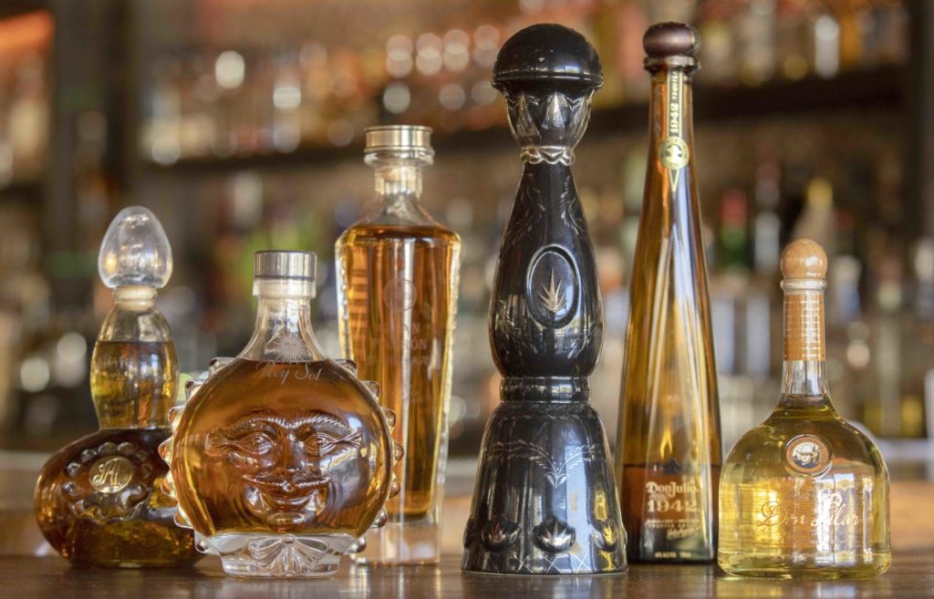Some of the over 200 varieties of tequila behind the bar at Cascabel Mexican Bar & Grill in Santa Rosa include: from left with prices by the 2 oz. pour, Asombroso, $41, San Matias Rey Sol, $59, Gran Patron Piedra, $49, Clase Azul, Ulta Extra Anejo, $245, Don Julio 1942, $36, Don Pilar, $34. (photo by John Burgess/The Press Democrat)