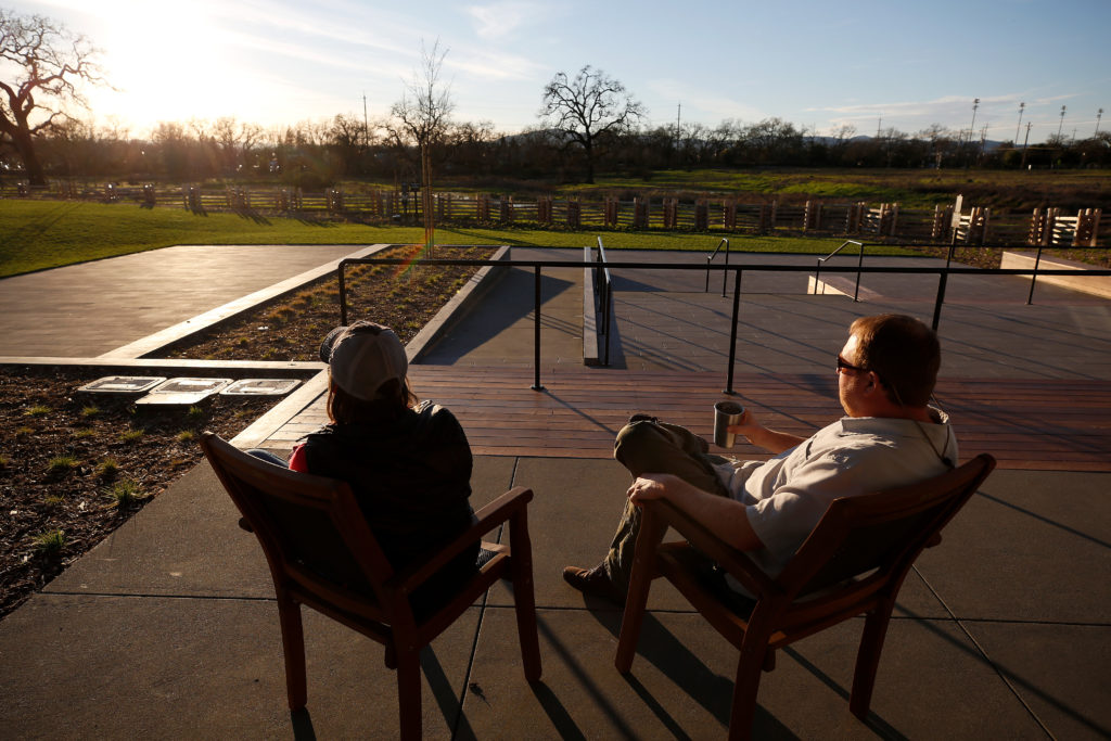 Amy and Nathan Booth enjoy drinks while taking in the sunset on the patio at Russian River Brewing Company in Windsor, California, on Wednesday, January 23, 2019. (Alvin Jornada / The Press Democrat)