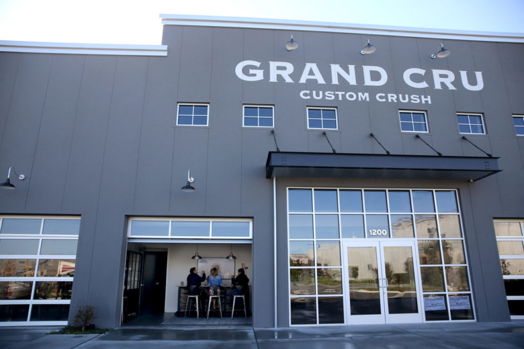 Guests do a wine tasting at Grand Cru Custom Crush in Windsor on Thursday, October 25, 2018. (BETH SCHLANKER/ The Press Democrat)