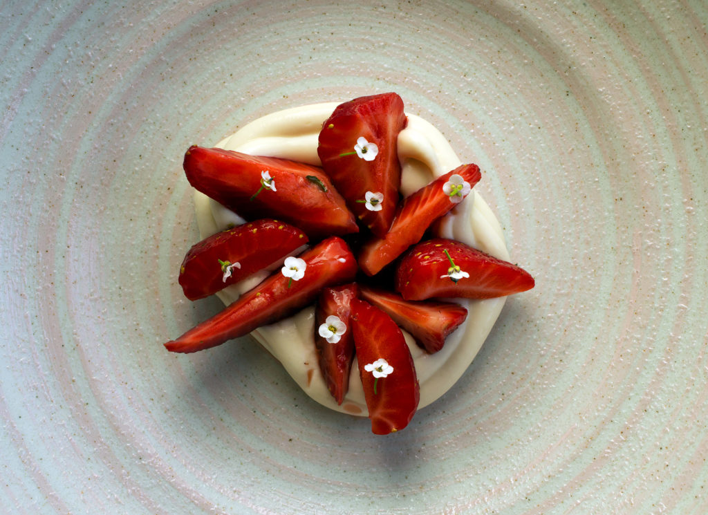 White chocolate infused with strawberry leaf, strawberry pickled in rhubarb skin vinegar and grilled honey from chef Matt Kammerer at the Harbor House in Elk along the Mendocino coast. (photo by John Burgess/The Press Democrat)