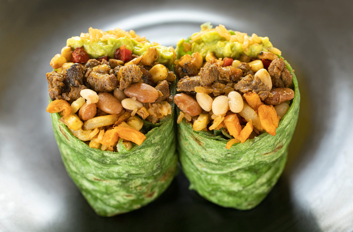 Tropical Beef Burrito with tropical potato mix, pinto and white beans, Spanish rice, guacamole, roasted corn & red pepper salsa in a spinach tortilla from Don Julio's Latin Grill & Pupusas in Rohnert Park on Monday, August 31, 2020. (John Burgess / The Press Democrat)