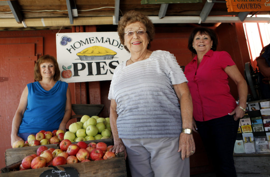 9/9/2012: T3: Carmen Kozlowski stands with her daughters Carol Kozlowski-Every, right, and Cindy Kozlowski-Hayworth on Thursday at the Kozlowski Farms store in Forestville. PC: Carmen Kozlowski with her daughters Carol Kozlowski-Every, right, and Cindy Kozlowski-Hayworth at the Kozlowski Farms store in Forestville, California on Thursday, September 6, 2012. (BETH SCHLANKER/ The Press Democrat)