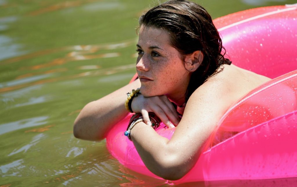 Jessica Medeiros listens to the music while floating on an inner tube at the Russian River Blues Festival on Sunday, June 17, 2007. (The Press Democrat/ Christopher Chung)