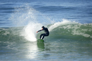 Surfing in Salmon Creek. (Conner Jay/The Press Democrat)