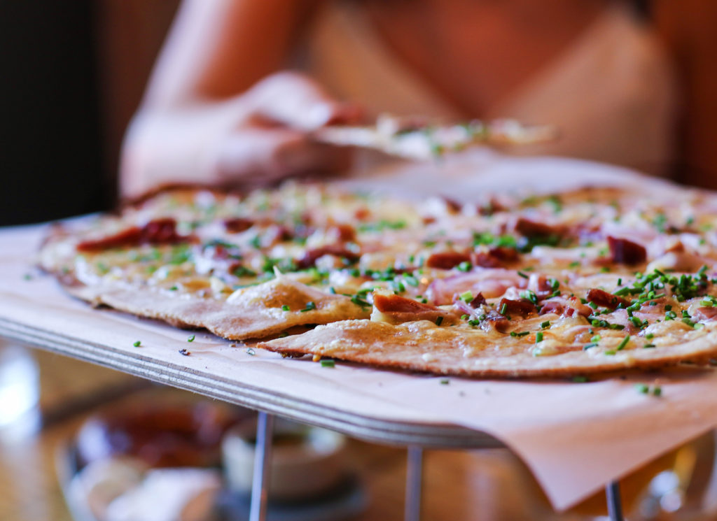 Flammkuchen flatbread with fromage blanc, onion, speck emmentaler and wild mushroom at Brot in Guerneville. Heather Irwin/PD