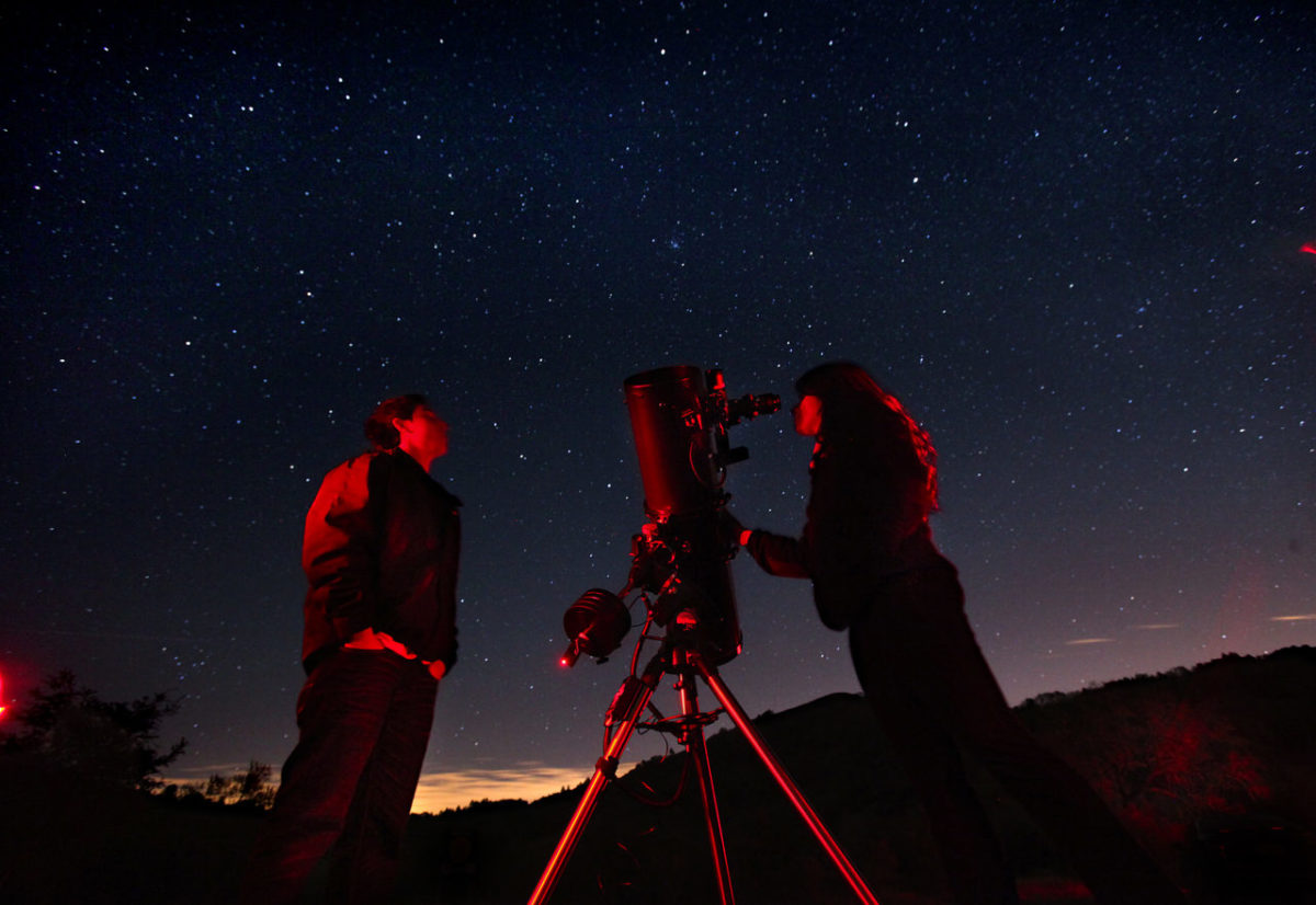 Santa Rosa Junior College astronomy students Marcos Indalecio, left, and Melanie Queiroz view the stars through a telescope belonging to amateur astronomer Dickson Yeager during the monthly public viewing night at the Ferguson Observatory in Sugarloaf Park. In addition to three permanent large telescopes, members of the observatory often bring their personal scopes for the public to enjoy.
