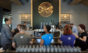 Seismic Brewing Co. brewmaster Andy Hopper, left, talks beer with Seismic's staff, Friday, June 28, 2019 prior to a soft opening of the brew pub at the Barlow Center in Sebastopol. (Kent Porter / The Press Democrat) 2019