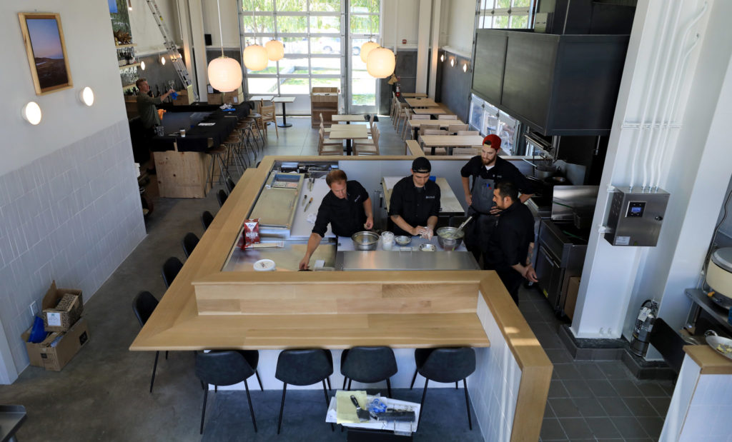 At Sushi Kosho in Sebastopol's Barlow district, Kosho's owner and executive chef Jake Rand, from left, sous chef Daniel Saaverda, chef de cuisine Ted Williams and sous chef Angel Cuxin, engage in food preparation, Friday, July 12, 2019. (Kent Porter / The Press Democrat) 2019