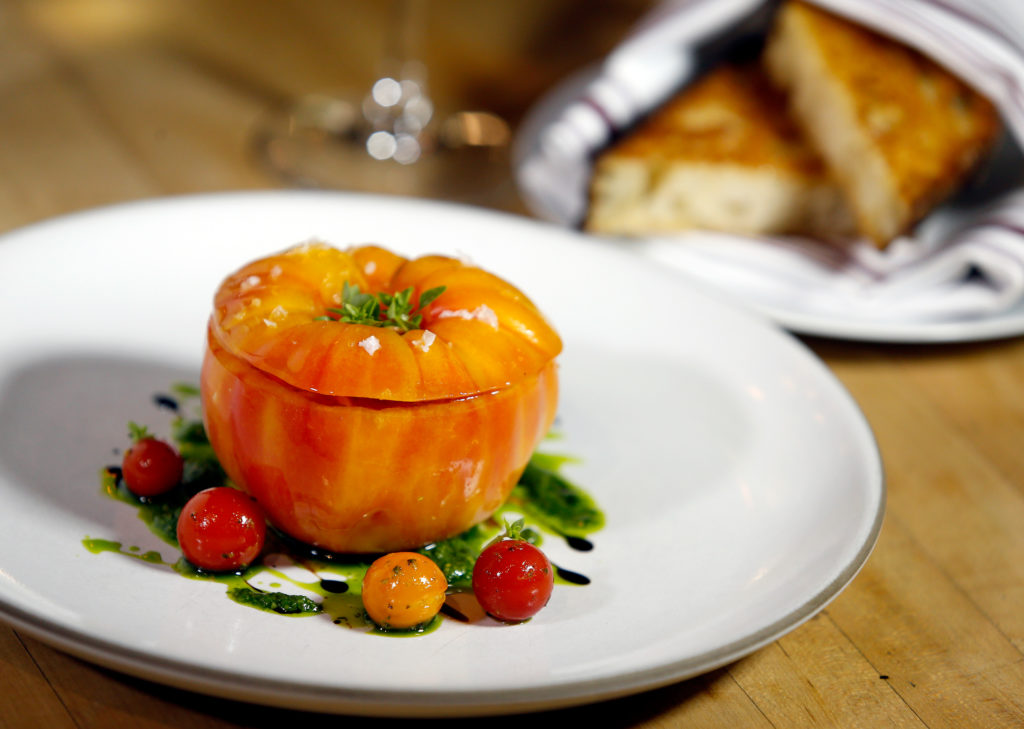 Burrata inside an heirloom tomato with crostini at Della Fattoria in Petaluma, California, on Thursday, August 23, 2018. (Alvin Jornada / The Press Democrat)