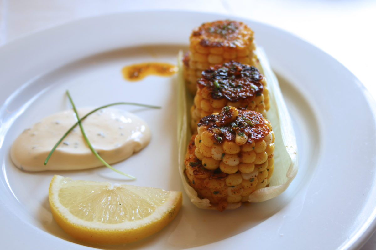 Elotitos, or oven-roasted corn with Jamaican jerk seasoning and chive crema at Guiso Latin Fusion. Photo: Heather Irwin.