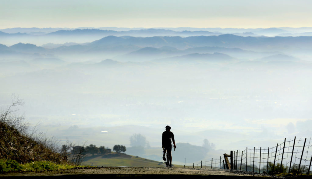 1/7/2015:A1:Chris Monson of Petaluma rides down Sonoma Mountain Road on Tuesday into a hazy valley. Another Spare the Air Day has been called for today. Last year, the Bay Area Air Quality Management District called an unprecedented 30 alerts during the winter. KENT PORTER / The Press Democrat PC:Chris Monson of Petaluma rides down Sonoma Mountain Road, Tuesday Jan. 6, 2015 in to a valley of smog as another Spare the Air Day has been called for on Wedensday. (Kent Porter / Press Democrat) 2015
