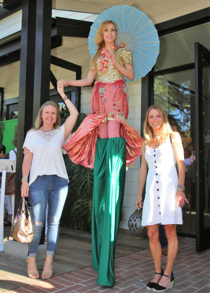 Krysta Cook (center) poses for photos with guests as they arrive at the Grand Reopening of MacArthur Place in Sonoma California, Thursday August 1, 2019. (Photo Will Bucquoy/For Sonoma Magazine).