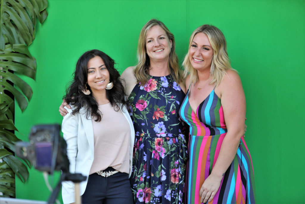 Melissa Albane, from left, Susan Kelly and Liz Tsutsumi pose for photos in the photo booth at the Grand Reopening of MacArthur Place in Sonoma California, Thursday August 1, 2019. (Photo Will Bucquoy/For Sonoma Magazine).