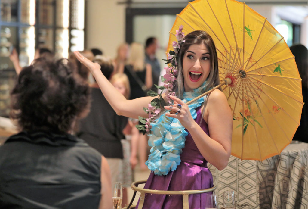 Josselyn Maquette greets guests with sparkling wine as they arrive at the Grand Reopening of MacArthur Place in Sonoma California, Thursday August 1, 2019. (Photo Will Bucquoy/For Sonoma Magazine).