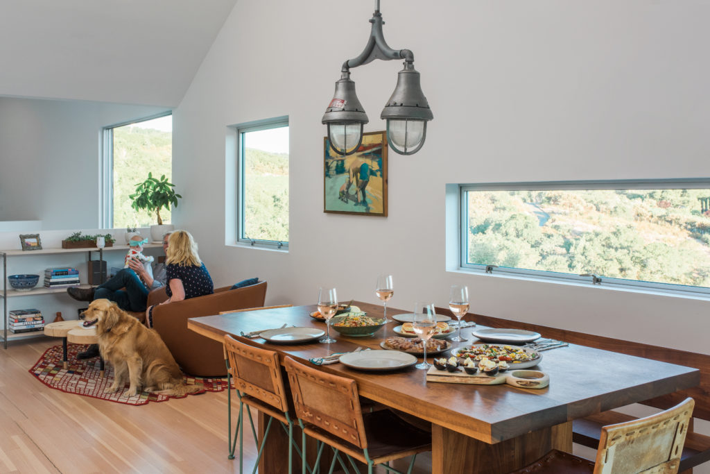 Over the dining room table hangs Crouse-Hinds Double Explosion Proof Chandelier from between 1940-1960