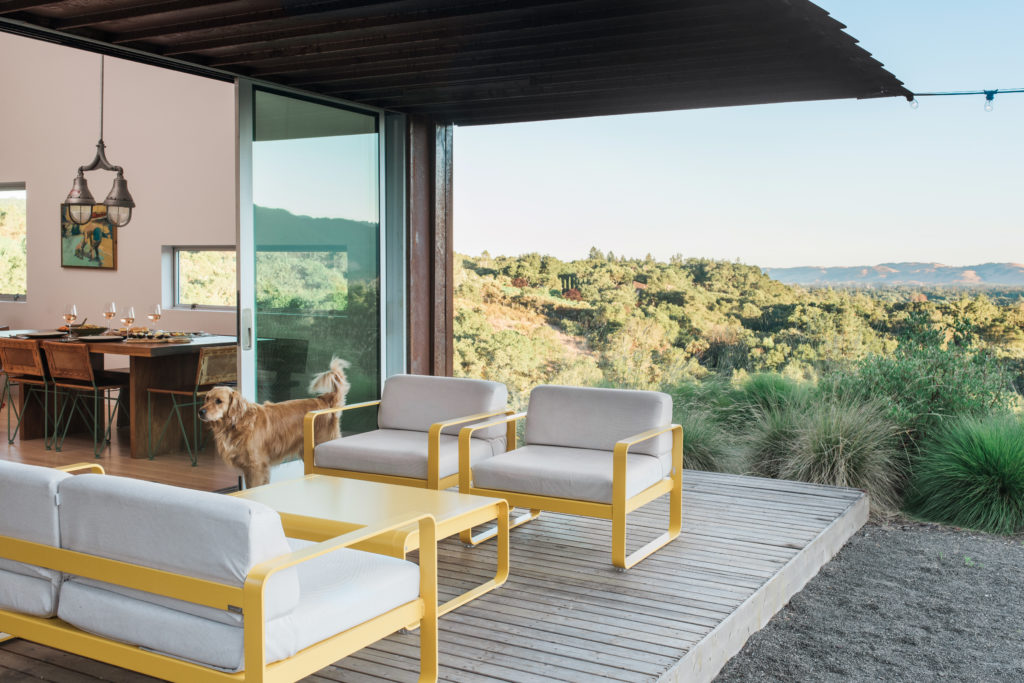 The yellow furniture just off the porch is a French designer called Fermob; it's from the Bellevie collection (we bought them from local Sonoma company, Villa Terraza)