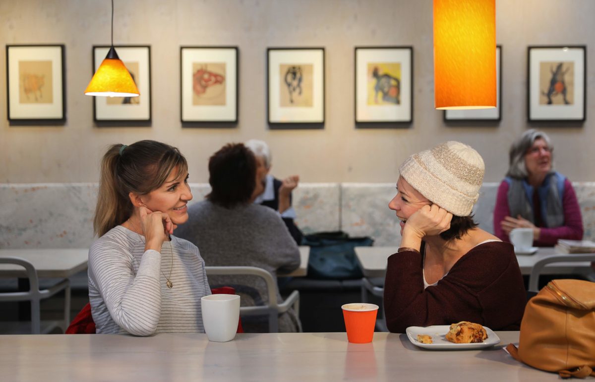 Maureen Vaillancourt, left, and Laura Carr talk at Cafe Frida Gallery, in the South of A Street arts district of Santa Rosa, on Friday, Jan. 24, 2020. (Christopher Chung/ The Press Democrat)
