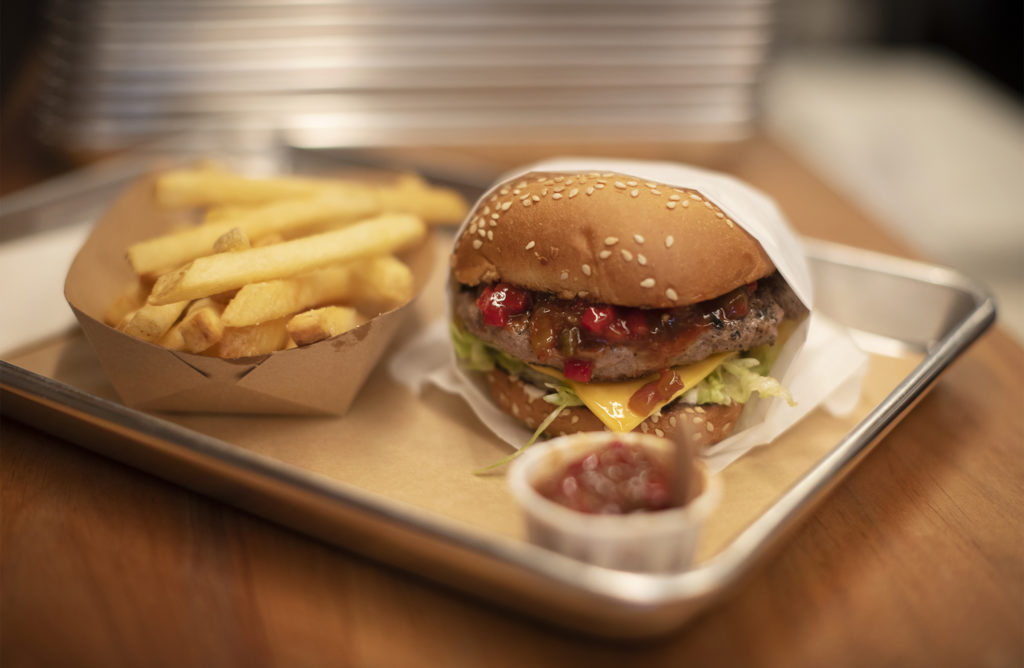 The Valley Joe, an old school cheeseburger made with a grill-seared beef patty, sharp American cheese, crisp shredded iceberg, mayo, and Chili Joe's secret red relish on a toasted sesame bun at Chili Joe's in Petaluma, California. April 6, 2019. (Photo: Erik Castro/for Sonoma Magazine)