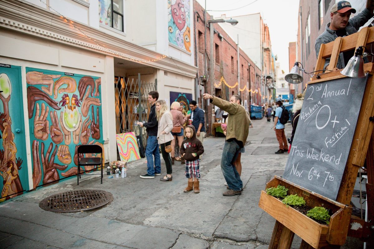 American Alley is covered in art for the the O+ Festival, a gathering of artisans and musicians that encourages access to health care for artists in Petaluma on Sunday, November 8, 2015. (Rachel Simpson / for the Petaluma Argus-Courier)