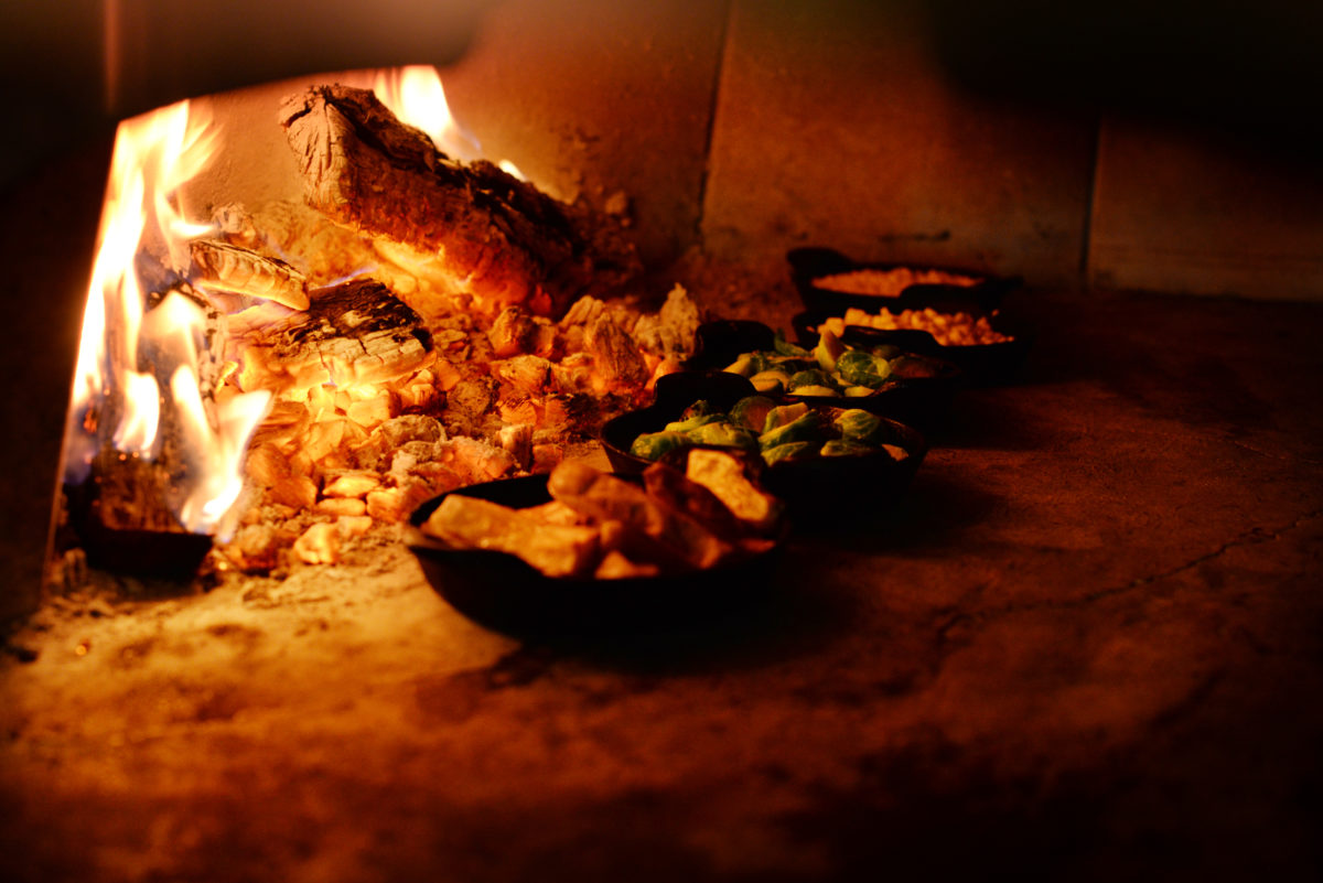 The Glen Ellen Star uses their wood-fired oven for a variety of menu items, including sweet potatoes, Brussels sprouts and corn kernels. (Erik Castro/for The Press Democrat)