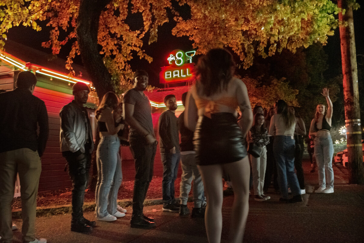 A steady line to enter The 8 Ball bar is present throughout most of the evening during a bar hopping night driven mostly by Sonoma State University students in Cotati Calif., Thursday, March 10, 2022. (Erik Castro/for The Press Democrat)