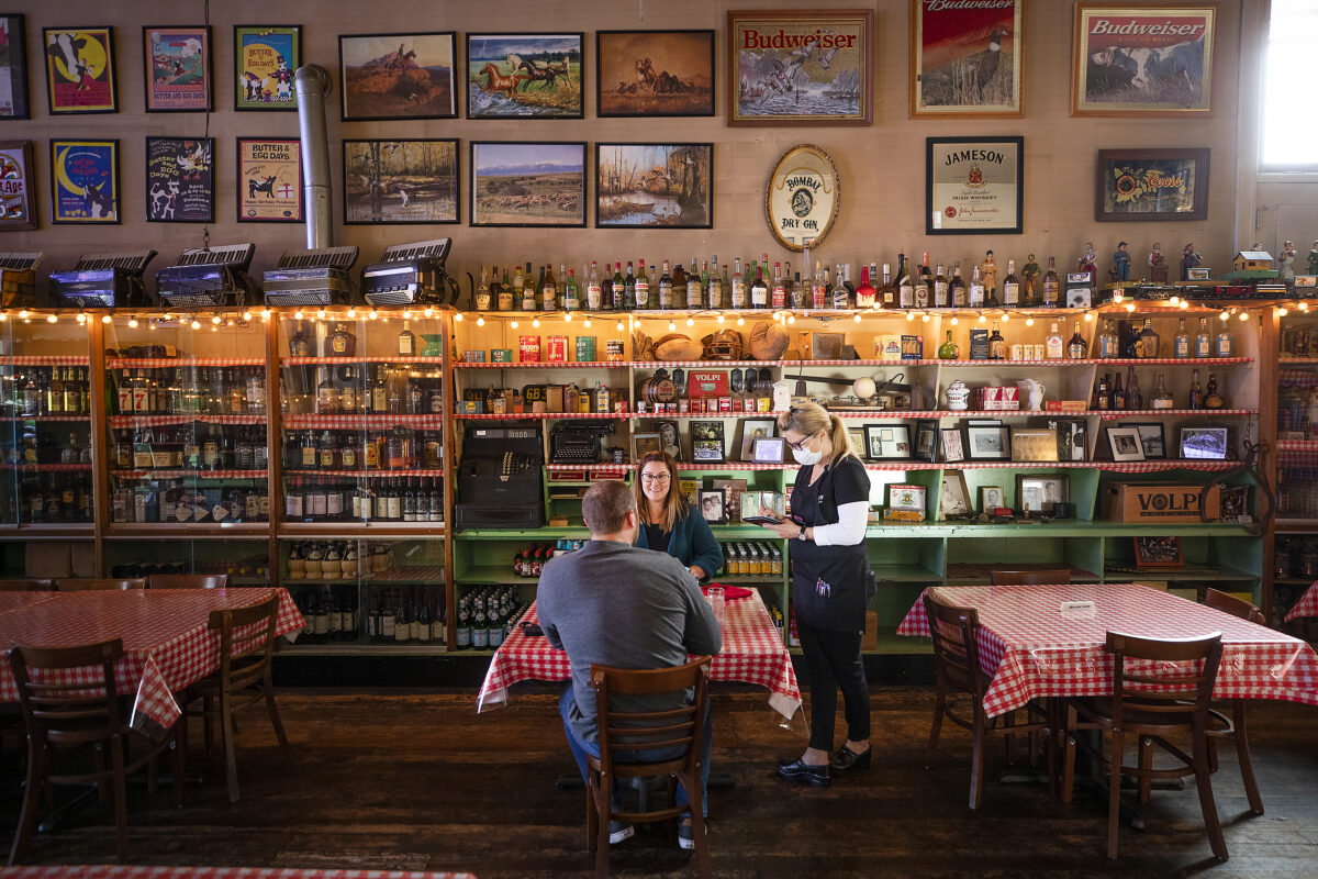 Wanda Lou takes an order from Pilar Marin and Andrew Reece on the opening night at Volpi's Ristorante & Bar in Petaluma after a year's hiatus since the start of the pandemic on Thursday, May 6, 2021. (John Burgess/The Press Democrat)