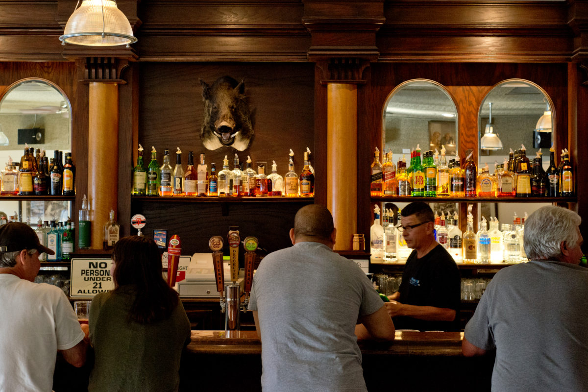 Patrons enjoy drinks and conversation at John and Zeke's in Healdsburg, California, on August 20, 2014. (Alvin Jornada / For The Press Democrat)