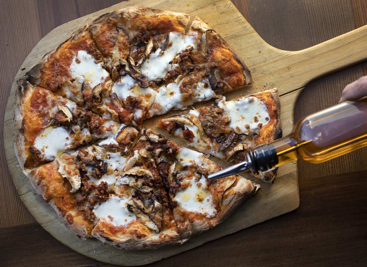 The Funguy pizza with house-made sausage, marinara, house-made mozzarella, shiitake mushrooms and a drizzle of house-made chili oil from Palooza Brewery and Gastropub in Kenwood. (photo by John Burgess/The Press Democrat)