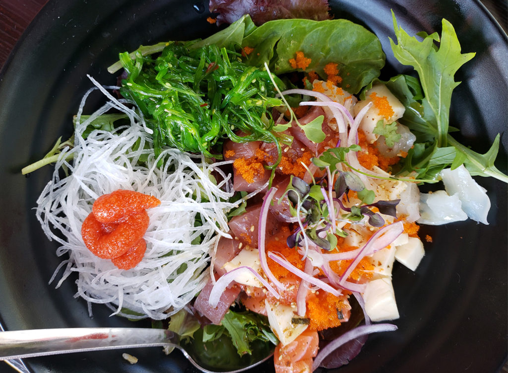 Kamura Don, Korean-style mixed sashimi bowl Hwae-dup bap served with an assortment of fish, seaweed salad, daikon, mixed greens, served over hot brown rice with a side of cho-jang Korean sweet and spicy sauce at Kamura Sushi. 3800 Sebastopol Rd, Santa Rosa