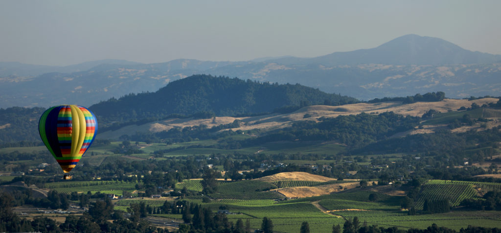 Geyser Peak and vineyards north of Windsor serve as a backdrop for the Sonoma County Hot Air Balloon Classic in Windsor, Friday, June 8, 2018. (Kent Porter / The Press Democrat) 2018